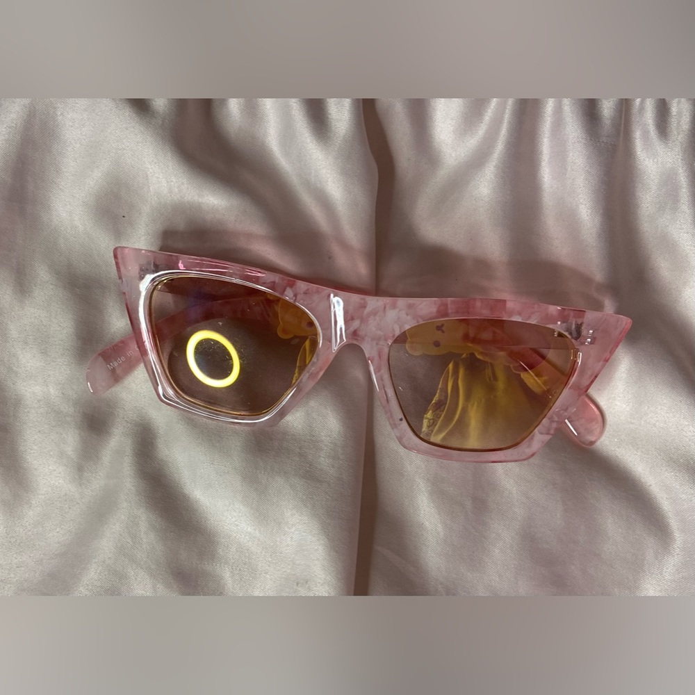 Pink sunglasses with yellow tinted lenses